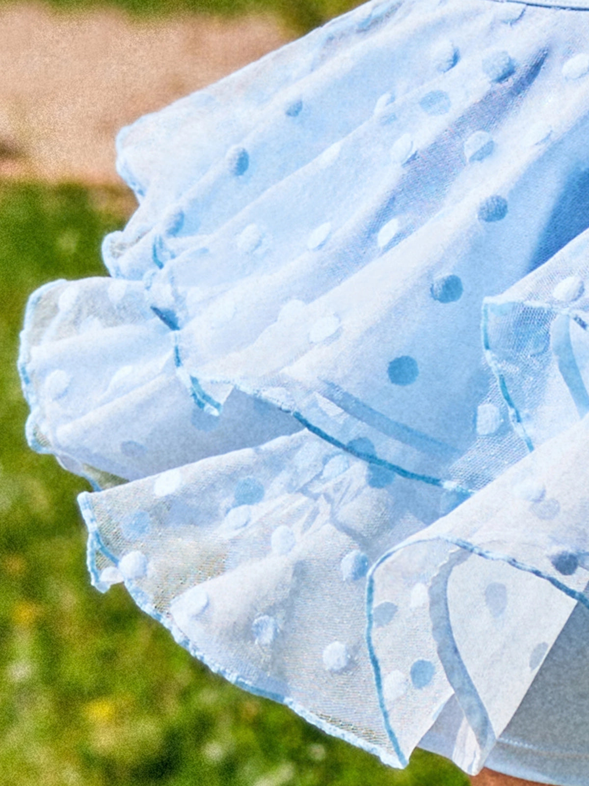 Macro detail of Pom Pêche x Betty Boop Paris blue Cake Skirt showing double-layer lightweight polka dot mesh with 3D raised dot texture and scalloped ruffle edges – ultra-light cool-touch LYCRA® 4-way stretch fabric