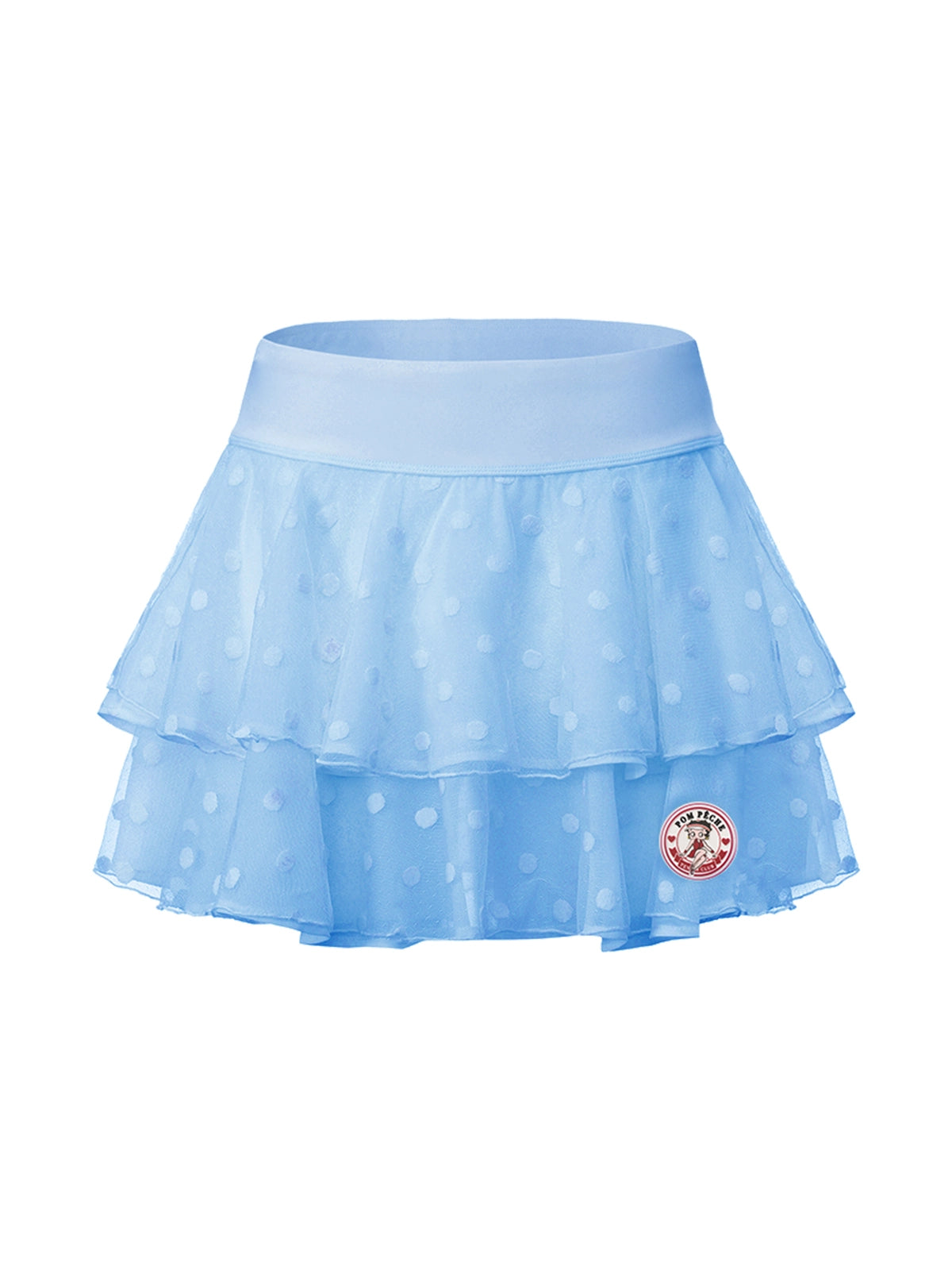 Flat lay of Pom Pêche x Betty Boop Cake Skirt in Paris blue – wide sky blue high waistband, double-layer lightweight polka dot mesh ruffle tiers and Betty Boop Pom Pêche circular badge on white background