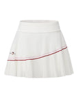 Flat lay of Pom Pêche x Betty Boop Pleated Panel Skirt in white – wide no-roll high waistband, asymmetric pleated panel with pink and burgundy contrast double piping and Betty Boop Pom Pêche embroidery on white background