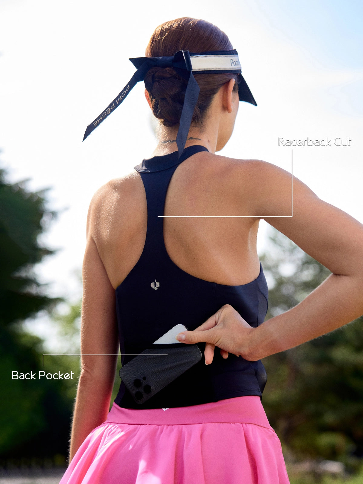 Back view of Pom Pêche zip-neck halter tank showing open racerback cut and back mesh pocket with phone – breathable design for unrestricted movement on court