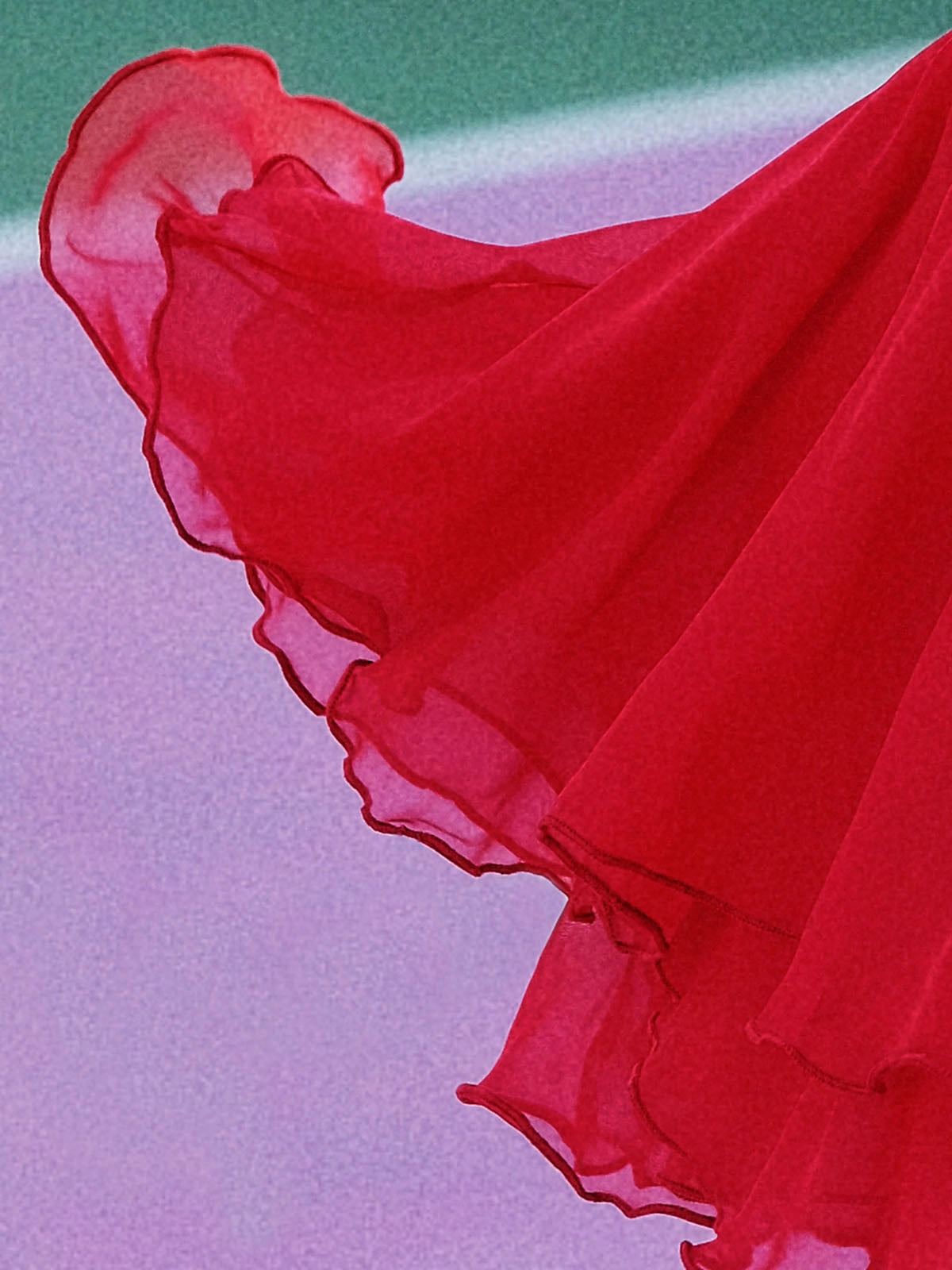 Macro detail of Pom Pêche wine red Petal Tiered Tennis Skirt showing featherlight chiffon layers with scalloped petal ruffle edges flying in motion – semi-sheer airy drape on purple clay court background