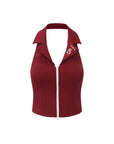 Flat lay of Pom Pêche Poise™ Rose Halter Polo Tank in Paris red – structured polo collar with Pom Pêche rose embroidery, full-length white dual-zipper and open halter back on white background