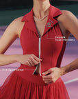 Close-up of Pom Pêche Paris red Poise™ Rose Halter Polo Tank with feature callouts – Exquisite Rose Embroidery on polo collar and Dual-Zipper Design annotated, model pulling zipper open on pink court