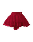 Flat lay of Pom Pêche Spin™ Petal Tiered Tennis Skirt in wine red – wide high waistband with Pom Pêche crown logo, three graduated asymmetric featherlight chiffon petal layers on white background