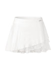 Flat lay of Pom Pêche Spin™ Waltz Layered Tennis Skirt in white – wide high waistband with Pom Pêche silver metal logo tag, three-layer asymmetric silhouette with fine pleated outer layer, sheer mesh mid-layer and scalloped ruffle hem on white background