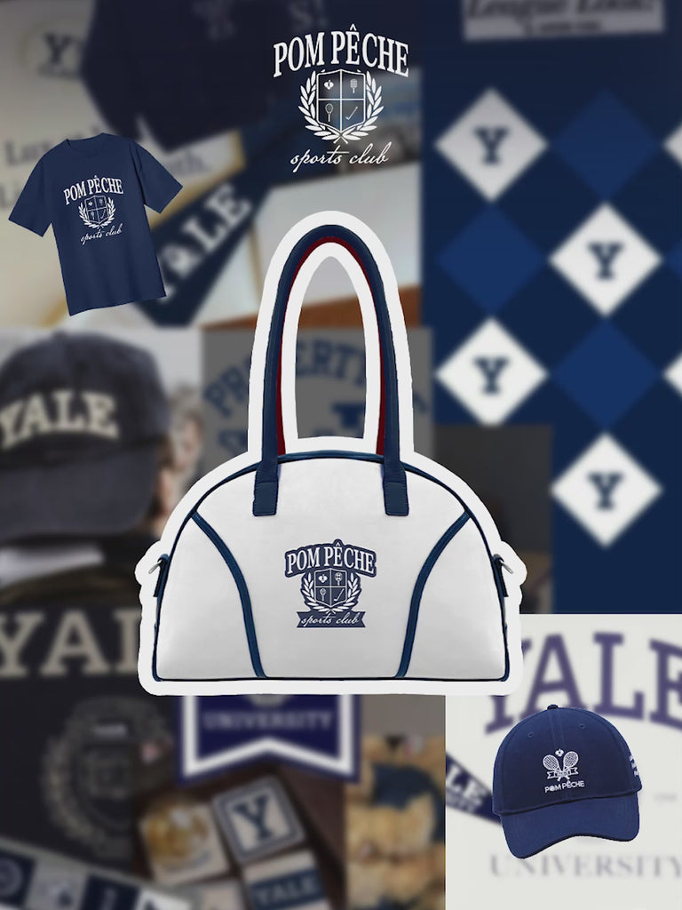 Cream dome tennis bag with contrast handles and Pom Pêche logo, styled on a tennis court.