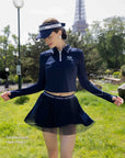 Spin Layered Mesh Pleated Tennis Skirt Navy detail, showcasing layered pleated mesh design, contrast logo waistband, flattering waist fit, and elegant tennis skort style