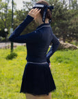 Spin Layered Mesh Pleated Tennis Skirt Navy side view outfit, showcasing layered pleated mesh silhouette, flattering fit, and elegant women's tennis style