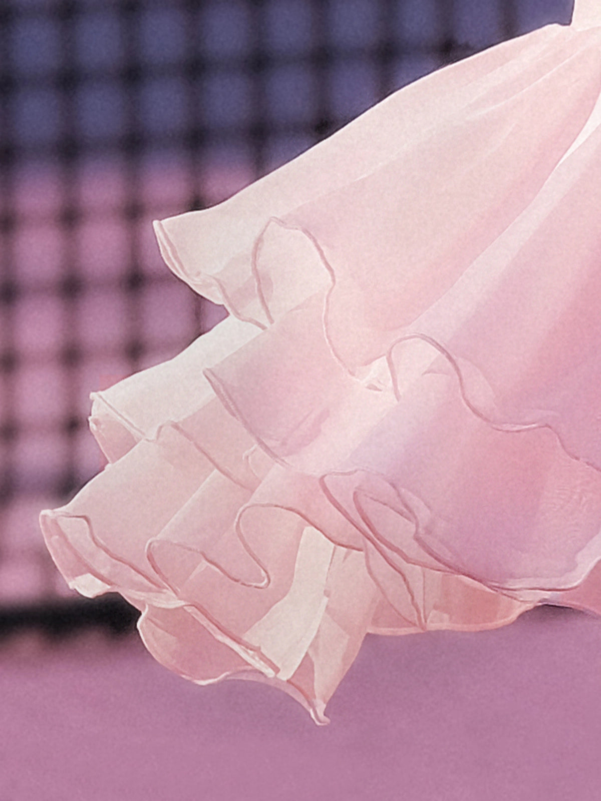 Spin Petal Tiered Skirt Light Pink in motion, showcasing flowing petal inspired tiered hem, lightweight chiffon layers, and graceful movement on and off the court