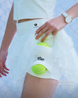 Spin Petal Tiered Skirt White pocket detail, featuring four built in pockets for tennis balls, phone, and everyday essentials in a practical tennis skort