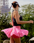 Spin Rose Fairy Spin Skirt dynamic movement, showcasing flowy petal chiffon hem, confident feminine style, and elegant tennis skort silhouette