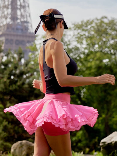 Spin Rose Fairy Spin Skirt dynamic movement, showcasing flowy petal chiffon hem, confident feminine style, and elegant tennis skort silhouette