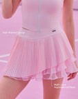 Spin™ Waltz Layered Skirt featuring multi-layer asymmetric pleats, sculpting waistband, and flexible tennis-ready design