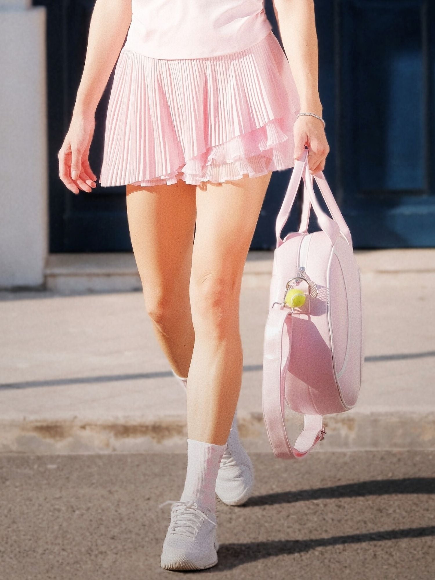 Spin Waltz Layered Skirt Light Pink close-up, highlighting soft fabric texture, layered pleated construction, and refined movement detail