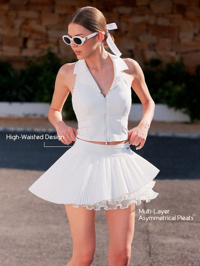 Spin Waltz Layered Tennis Skort White detail, showcasing high waisted waistband, asymmetric layered pleats, flattering silhouette, and elegant movement