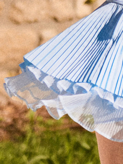 Blue Waltz layered skirt with asymmetrical pleats and multi-layer hem detail