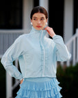 Model wearing light blue UPF cropped sun jacket, women’s lightweight breathable outdoor activewear
