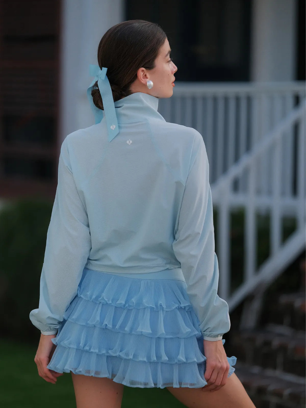 Light blue cropped sun jacket side view, women’s UPF lightweight sporty jacket fit