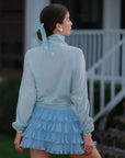 Light blue cropped sun jacket side view, women’s UPF lightweight sporty jacket fit